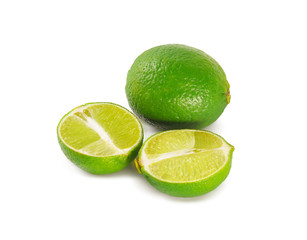 Limes with slices isolated on white background