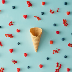 Ice cream cone with forest fruit pattern. Flat lay. Summer concept.