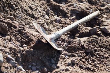 Shovel on a mixture of concrete at the construction site