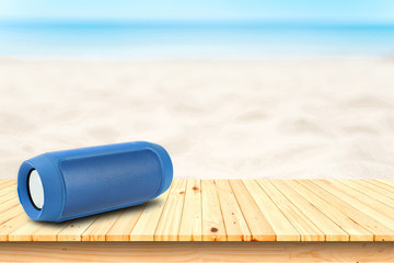 Portable speakers on wooden boards Near the sea in summer