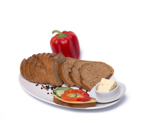 Composition with black bread on a white plate
