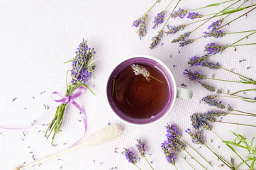 Lavender tea with flowers and sugar stick