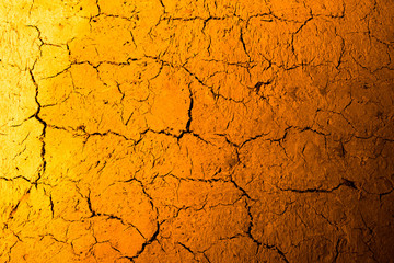 Clay wall in golden light as background