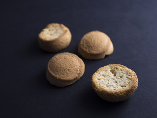 Fototapeta na wymiar Kammerjunker - small Danish crisp biscuits usually eaten with cold buttermilk soup for dessert - isolated on black background