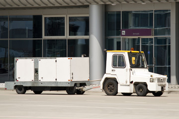 Tractor with airport ground power unit at arrival gate