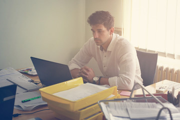 Fototapeta premium Young entrepreneur working from office.