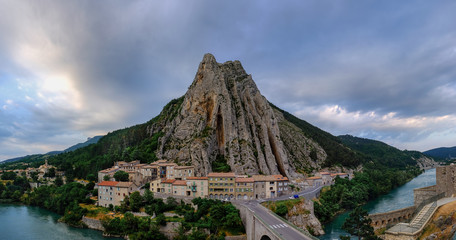 Very large panoramic view of Sisteron on the Durance river, Rocher de la Baume opposite the old town. France