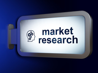 Advertising concept: Market Research and Head With Gears on billboard background