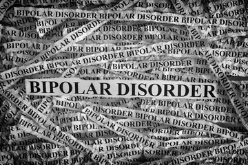 Torn pieces of paper with the words Bipolar Disorder