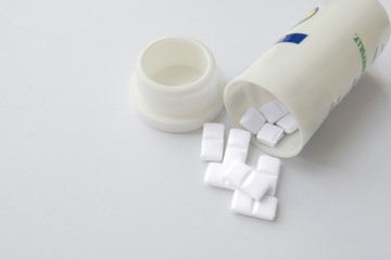 Pills spilling out of pill bottle. Top view with copy space.