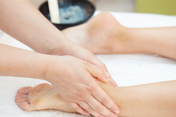 Obraz na płótnie Canvas Woman Getting a Salt Scrub Beauty Treatment in the Health Spa