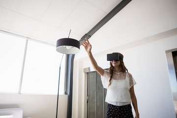 Businesswoman wearing virtual reality simulator