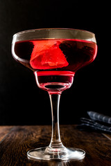Boulevardier cocktail with lemon peel.