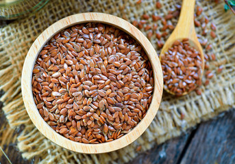 Flax seeds in a bowl on table