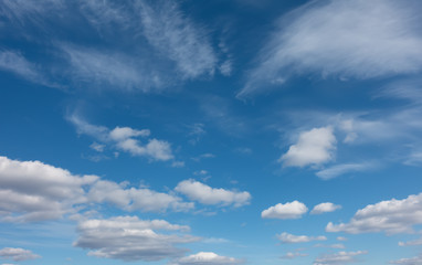 Beautiful clouds flying against blue sky at sunny day.