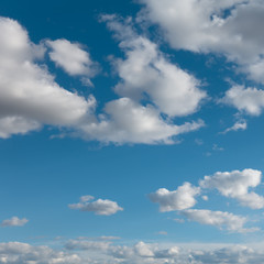 Beautiful light blue sky and clouds. Clouds flying over horizon, cloudscape.