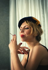 Obraz premium Vintage woman portrait with cigarette