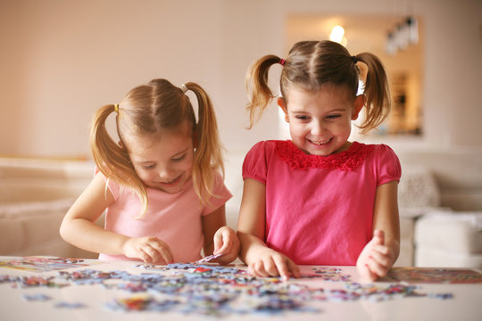 Girls playing puzzle
