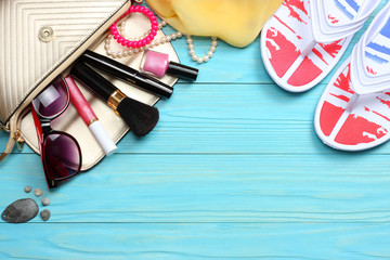 Summer blue background. Top view of beach summer accessories on blue wooden background with copy space. Horizontal frame for spa or wellness concept