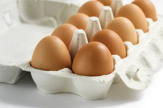 Raw eggs closeup, soft focus. Eggs in the box