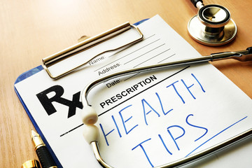 Prescription form with written words Health Tips.