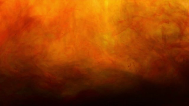 Abstract black ink in water on a red background