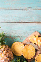 Fototapeta na wymiar pineapple on the wood texture background..