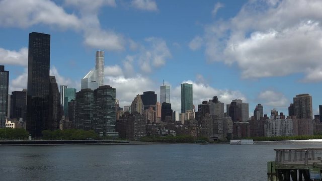 Viewing beautiful breathtaking Manhattan Skyline from Long Island City in New York, wide shot panorama with ONU,United Nations Headquarters,Ultra Hd 4k, real time