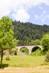 Fototapeta na wymiar Railway bridge in stone with arches