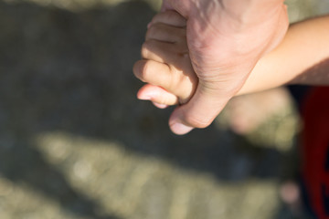 Parents holding hands