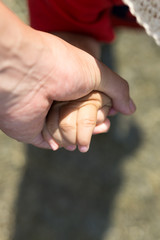 Parents holding hands