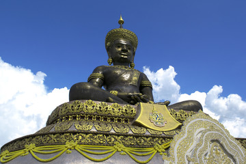 Fototapeta premium Phra Buddha Maha Dhammaraja Chaloem Phra Kiat statue at Pechabura Buddhist Park.Thailand