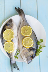 Fresh raw fish with lemon 