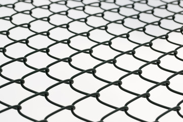 Metal mesh wire fence closeup.