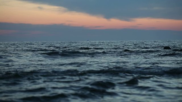 Drk waters. Dramatic sunset in the sea