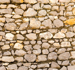 Wall made of granite stones as background