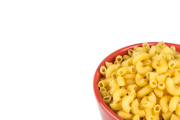bowl of dried pasta or elbow pasta over white background