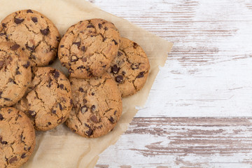 chocolate cookies on white wooden background