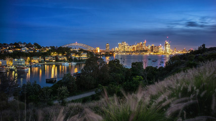 Fototapeta na wymiar View of Sydney City at dusk from Balls Head Reserve, Sydney, Australia