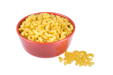 bowl of dried pasta or elbow pasta over white background