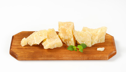 Parmesan cheese on cutting board