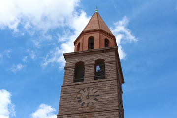 Fototapeta na wymiar Campanile orologio torre San Ponziano Carbonia Sulcis Sardegna