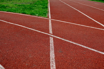 treadmills at the stadium, direct, bending, closeup, background