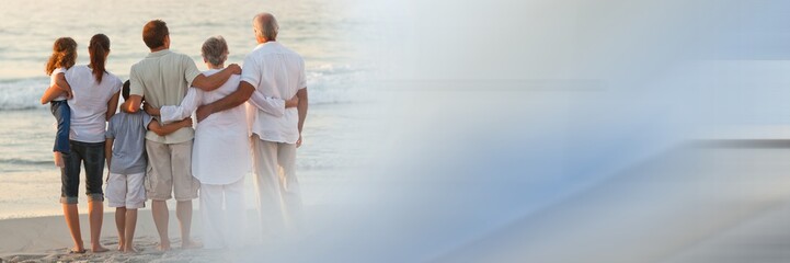 Fototapeta premium Back of family at beach with blue and grey transition