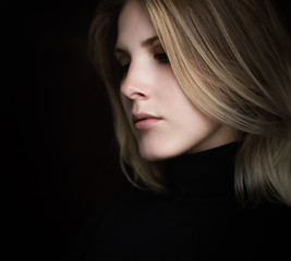 Fototapeta premium Portrait of beautiful young woman. Selective soft focus.