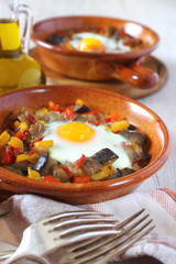 Ratatouille with egg in two ceramic plates