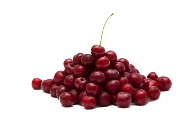 Handful of a red cherry on a white background