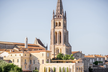 Fototapeta na wymiar Beautiful cityscape view on Saint Emilion village with church tower in Bordeaux region during the sunset in France