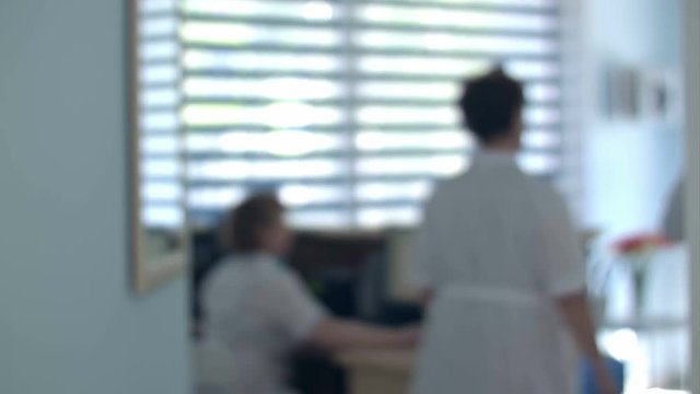 Busy hospital reception with doctors and receptionists