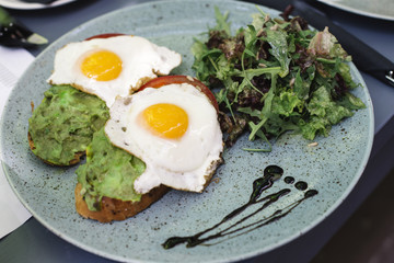 Fresh breakfest, fried eggs and salad